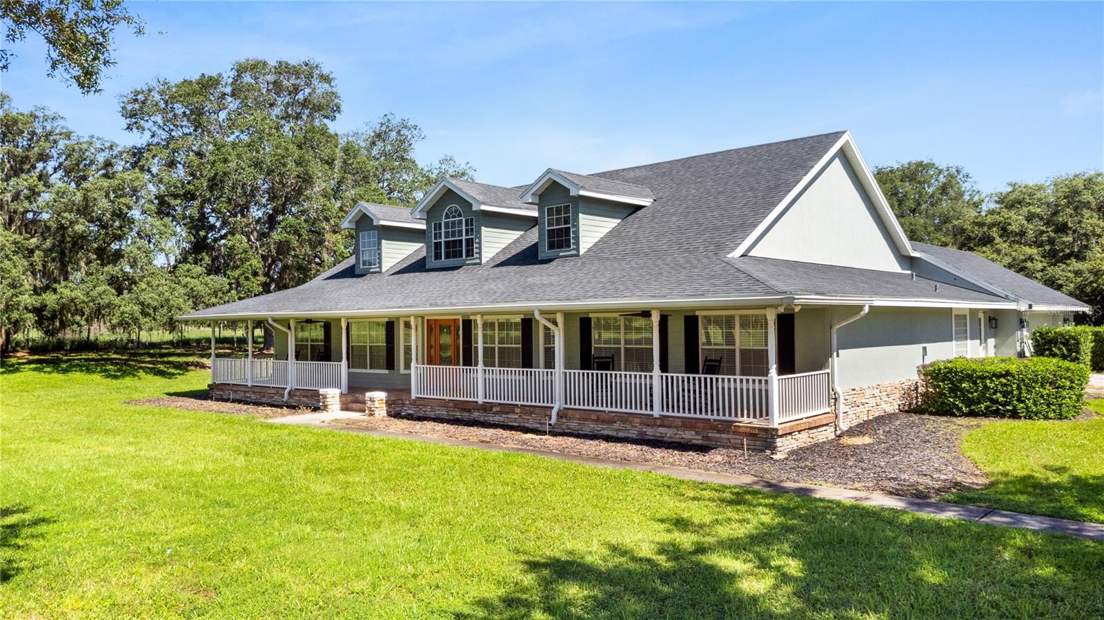Photo of 9045 LAKE HATCHINEHA RD, HAINES CITY, FL 33844